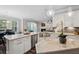 Open kitchen with an oversized island and stainless steel appliances provides ample space for cooking at 283 Saxony Loop, Summerville, SC 29486