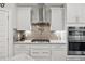 Well-equipped kitchen with white cabinets, stainless steel appliances, and granite countertops at 283 Saxony Loop, Summerville, SC 29486