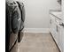 Laundry room featuring modern appliances and ample storage space at 283 Saxony Loop, Summerville, SC 29486