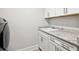 Laundry room with modern appliances, ample counter space, and white cabinets at 283 Saxony Loop, Summerville, SC 29486