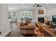 Living room with hardwood floors, fireplace, and an arched window leading to an adjacent room at 283 Saxony Loop, Summerville, SC 29486