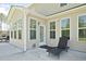 A covered patio features an outdoor lounge chair and offers serene outdoor living space at 283 Saxony Loop, Summerville, SC 29486