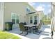 Outdoor patio with wicker dining furniture and exterior view of the home at 283 Saxony Loop, Summerville, SC 29486