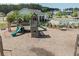 Community playground with slides and climbing structure next to a swimming pool at 283 Saxony Loop, Summerville, SC 29486