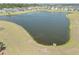 Scenic aerial view of a pond surrounded by lush greenery and open spaces, perfect for nature lovers at 283 Saxony Loop, Summerville, SC 29486