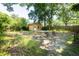 Backyard features a shed with a covered platform and rustic seating surrounded by lush greenery at 2963 Alabama Dr, North Charleston, SC 29405