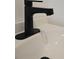 Matte black modern style bathroom sink fixture on a white vanity at 2963 Alabama Dr, North Charleston, SC 29405