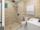 Cozy bathroom showcasing sleek fixtures, modern tiling, and a shower with glass doors at 2963 Alabama Dr, North Charleston, SC 29405