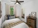 Comfortable bedroom with neutral tones, a window, and rustic furnishings offering a peaceful retreat at 2963 Alabama Dr, North Charleston, SC 29405