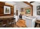 Open kitchen with a breakfast bar, sleek white cabinets, and modern stainless steel appliances is ready for cooking at 2963 Alabama Dr, North Charleston, SC 29405