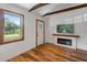 A living room with wood floors, a fireplace, and a large window with a view at 2963 Alabama Dr, North Charleston, SC 29405