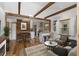 Open-concept living room with exposed wooden beams, wood accents, and modern decor is an inviting space at 2963 Alabama Dr, North Charleston, SC 29405