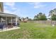 Spacious backyard with a screened-in patio, a large grassy area, and a privacy fence at 301 Edenton Rd, Goose Creek, SC 29445