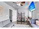 Bright bedroom with a ceiling fan, built-in shelving, and a desk at 301 Edenton Rd, Goose Creek, SC 29445