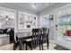 Charming dining room with dark table and chairs and outdoor access at 301 Edenton Rd, Goose Creek, SC 29445