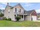 Traditional home with a covered porch and a two-car garage at 301 Edenton Rd, Goose Creek, SC 29445