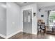 Inviting foyer with stylish gray door, hardwood floors, and modern accents at 301 Edenton Rd, Goose Creek, SC 29445