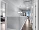 Upstairs hallway with hardwood flooring and elegant lighting at 301 Edenton Rd, Goose Creek, SC 29445