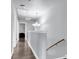Light and bright hallway features hardwood floors, modern lighting, and neutral paint at 301 Edenton Rd, Goose Creek, SC 29445