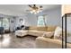 Comfortable living room with hardwood floors, ceiling fan, and large sectional sofa at 301 Edenton Rd, Goose Creek, SC 29445