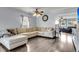 Comfortable living room with hardwood floors, ceiling fan, and large sectional sofa at 301 Edenton Rd, Goose Creek, SC 29445