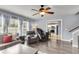 Open-concept living area with hardwood floors, lots of light and access to the kitchen at 301 Edenton Rd, Goose Creek, SC 29445