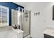 The modern main bathroom features a glass shower, a large soaking tub, and a window allowing natural light at 301 Edenton Rd, Goose Creek, SC 29445