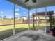 Covered screened in porch, hammock and grass backyard at 301 Mondo Ct, Summerville, SC 29486
