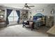 Bright primary bedroom with bench seating, a ceiling fan, and soft natural light at 301 Mondo Ct, Summerville, SC 29486