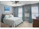 Cozy bedroom featuring natural light, a queen-sized bed with nautical themed bedding, and light gray walls at 301 Mondo Ct, Summerville, SC 29486