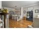 Dining room features hardwood floors, wainscoting, and an industrial style light fixture at 301 Mondo Ct, Summerville, SC 29486