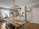 Bright dining room features a large wooden table and seating for eight at 301 Mondo Ct, Summerville, SC 29486