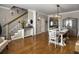 Formal dining room features hardwood floors, wainscoting, and modern lighting at 301 Mondo Ct, Summerville, SC 29486