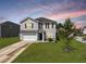 Charming two-story home features a well-maintained lawn and a two-car garage at 301 Mondo Ct, Summerville, SC 29486