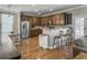 Kitchen features stainless steel appliances, granite countertops, and bar stool seating at 301 Mondo Ct, Summerville, SC 29486