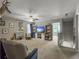 Spacious living room featuring a ceiling fan and entertainment center and doorway to another room at 301 Mondo Ct, Summerville, SC 29486