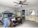 Primary bedroom featuring a ceiling fan, two dressers, and an ensuite bathroom at 301 Mondo Ct, Summerville, SC 29486
