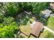 Aerial shot showing the home with a large backyard, patio, and surrounding trees at 305 Forest Cir, Summerville, SC 29483