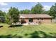 Backyard with patio area, dining space, and ample green space at 305 Forest Cir, Summerville, SC 29483