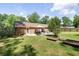 Backyard with patio, barbecue area, and lush lawn at 305 Forest Cir, Summerville, SC 29483