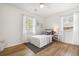 Bright bedroom featuring a cozy twin bed, ceiling fan, and windows with stylish curtains at 305 Forest Cir, Summerville, SC 29483