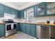 Modern kitchen with stainless steel appliances, custom cabinetry, and wood countertops at 305 Forest Cir, Summerville, SC 29483