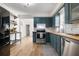 Eat-in kitchen featuring stainless steel appliances, custom blue cabinets, and butcher block countertops at 305 Forest Cir, Summerville, SC 29483