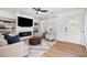 Cozy living room with fireplace, built-in shelving, neutral tones, and natural light at 305 Forest Cir, Summerville, SC 29483