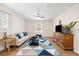 Spacious living room with plenty of natural light, a ceiling fan and hard wood floors at 305 Forest Cir, Summerville, SC 29483