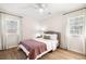 Cozy bedroom with hardwood floors, a ceiling fan, and bright natural light at 305 Forest Cir, Summerville, SC 29483
