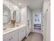 Bathroom view showing double sinks, decorative mirrors, wallpaper and a view into the bedroom at 307 Fox Gap Rd, Summerville, SC 29486