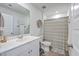 Well-lit bathroom featuring a large mirror, toilet, shower with curtain, and a vanity with storage at 307 Fox Gap Rd, Summerville, SC 29486