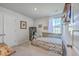 Bright bedroom includes a daybed, neutral decor and plenty of natural light from the window at 307 Fox Gap Rd, Summerville, SC 29486