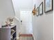 Bright entryway featuring decor and a staircase, complemented by neutral wall paint and light flooring at 307 Fox Gap Rd, Summerville, SC 29486